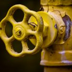 close up photo of a yellow shut off valve